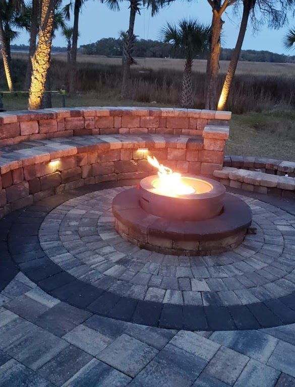 Custom natural gas fire pit installed by Alpha Gas Services at sunset